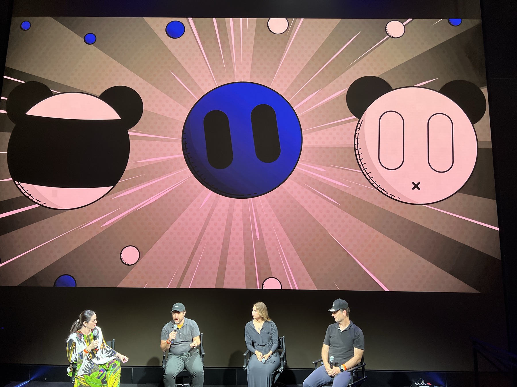 Supermental projected at NFT NYC — comic burst with three icons (head-on)